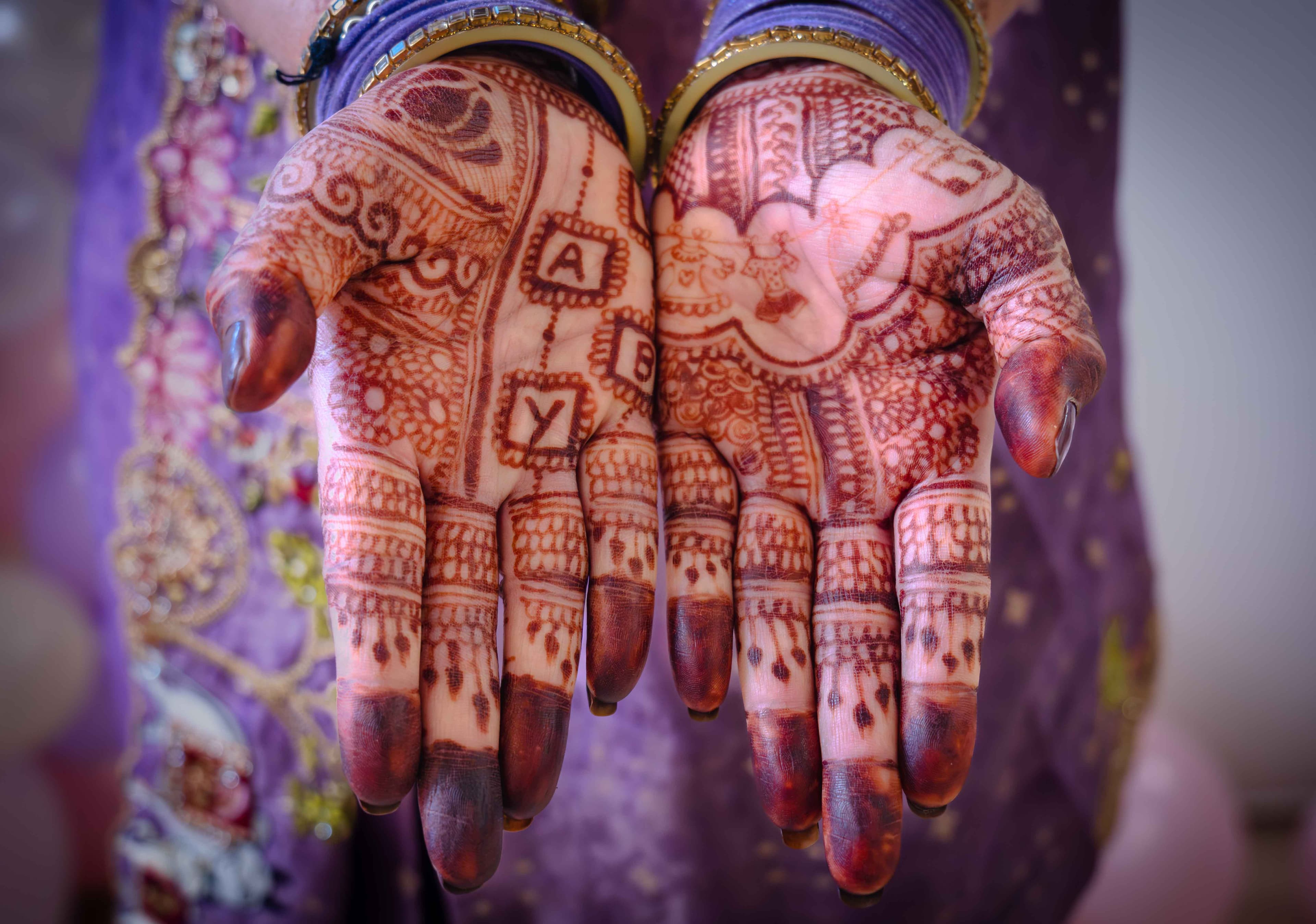 Detailed henna mehndi designs on a bride's hands